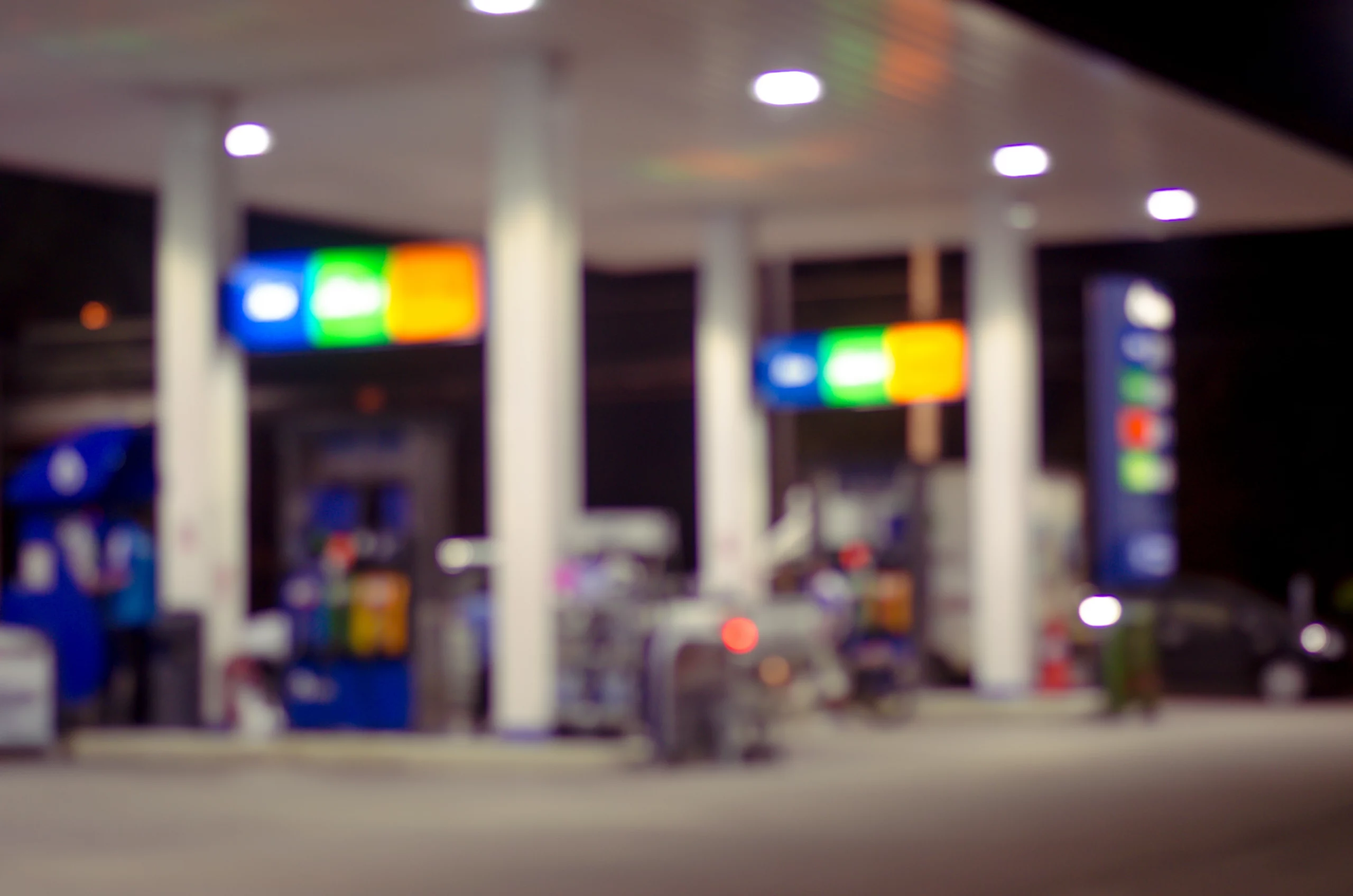 A blurry image of a gas station.