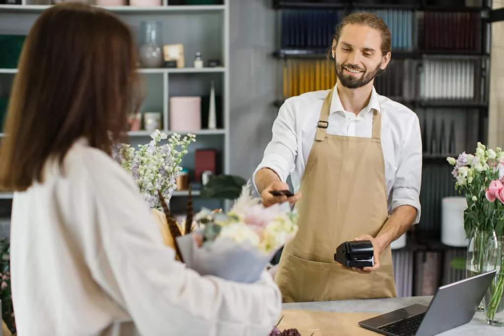 A woman interacting with a merchant service provider.