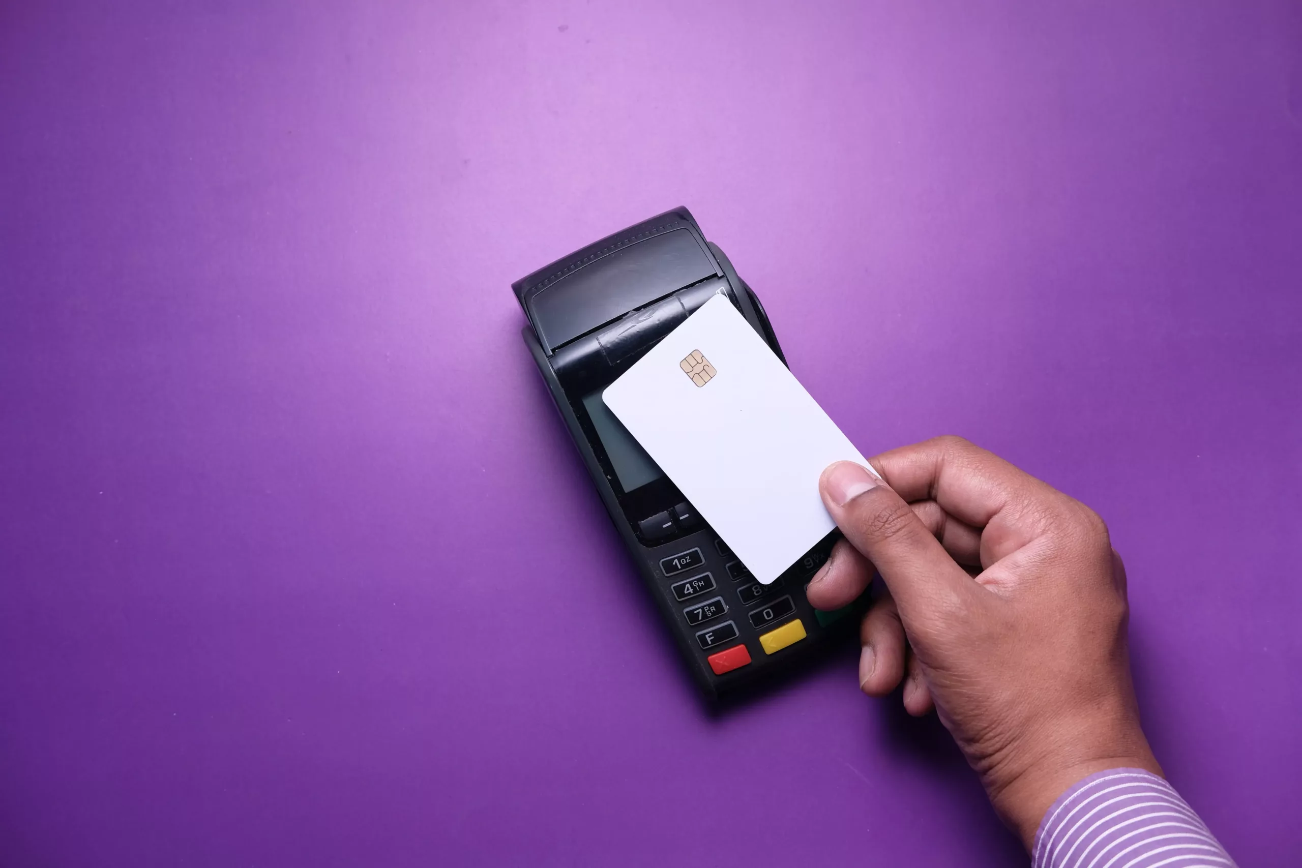 An image of a man tapping a card on a reliable payments partner terminal.